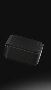 Vessel Ash black ashtray with storage shown opening and closing
