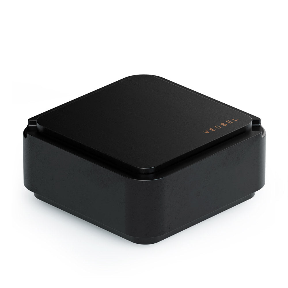 Vessel Ash black ashtray with integrated storage, closed lid view