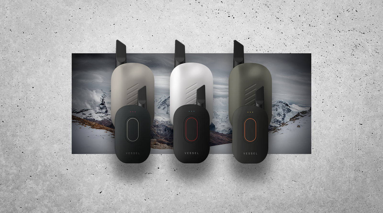 Three Vessel Compass vape batteries shown front and back in multiple colorways against a snow-capped mountain backdrop