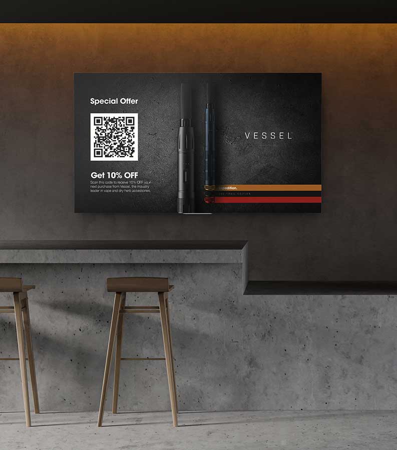 Contemporary retail space featuring polished concrete bar, wooden bar stools, corrugated metal accent wall, and wall-mounted screen displaying Vessel special offer